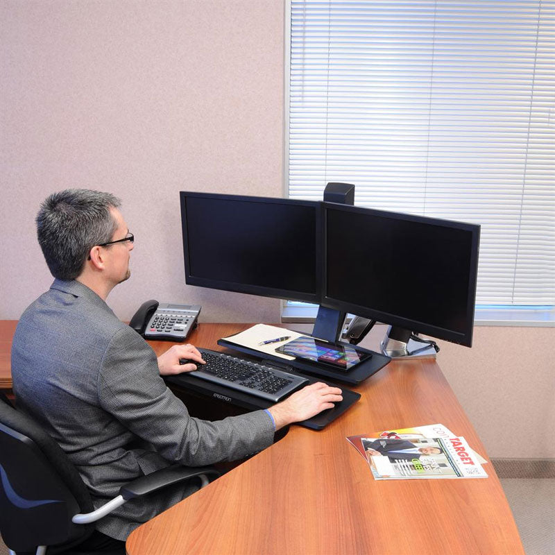 Ergotron Sit-Stand Desk Arm 24-316-026, seated person using a dual-monitor sit-stand workstation