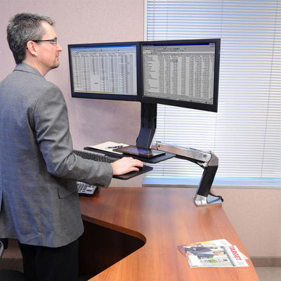 Ergotron Sit-Stand Desk Arm 24-316-026, standing person using a dual-monitor sit-stand workstation