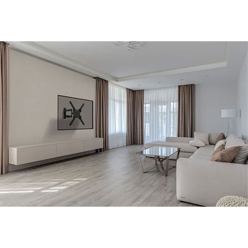 B-Tech Neomounts Large Full Motion TV Wall Mount WL40-550BL14, articulating wall mount installed living room view