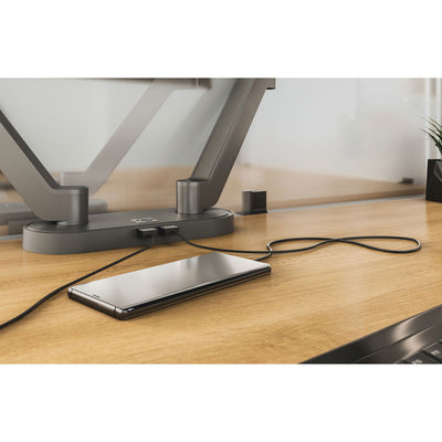 Chief Koncis USB Charging Hub D2US-NA, desk-mounted monitor stand hub charging a smartphone