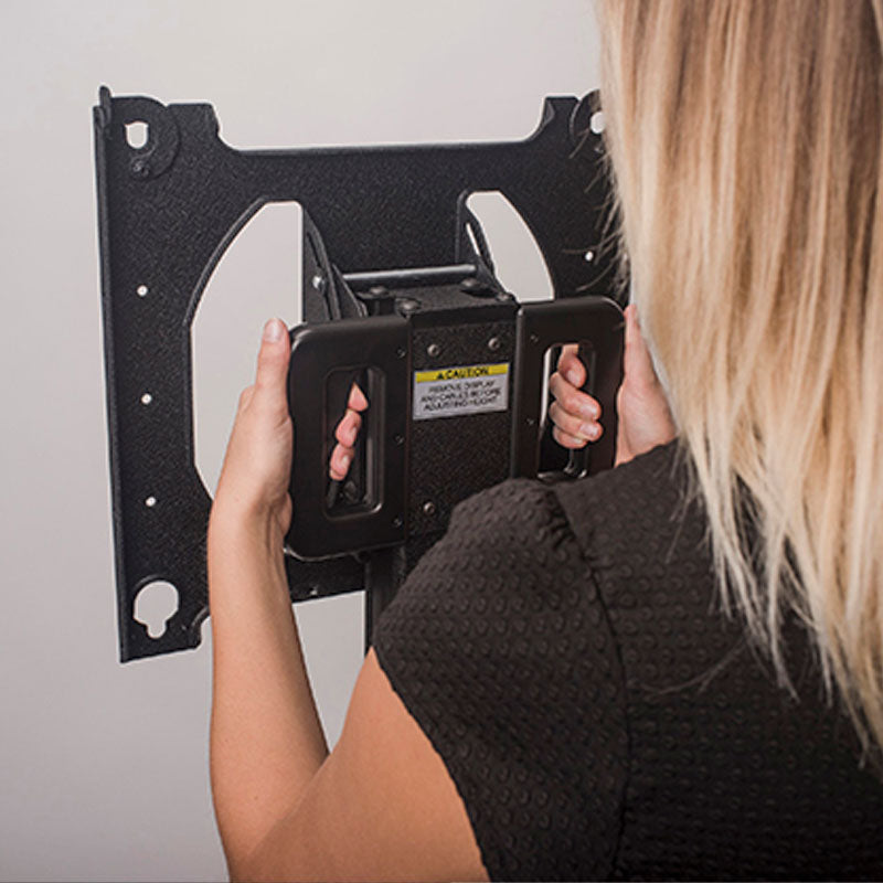 Chief Large Portable Flat Panel Stand, PRSU, portable display stand carrying handle in use