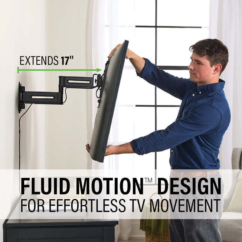 Sanus Small Adv Full-Motion 4D + Shift TV Mount VSF817-B2, person moving a television on a full-motion wall mount