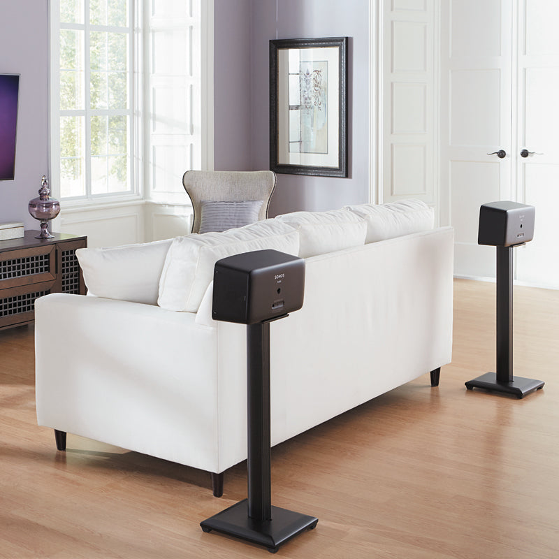 Sanus Natural Foundations Wood Speaker Stands NF30B, pair of speaker stands installed behind sofa