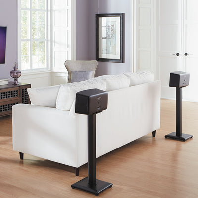 Sanus Natural Foundations Wood Speaker Stands NF30B, pair of speaker stands installed behind sofa