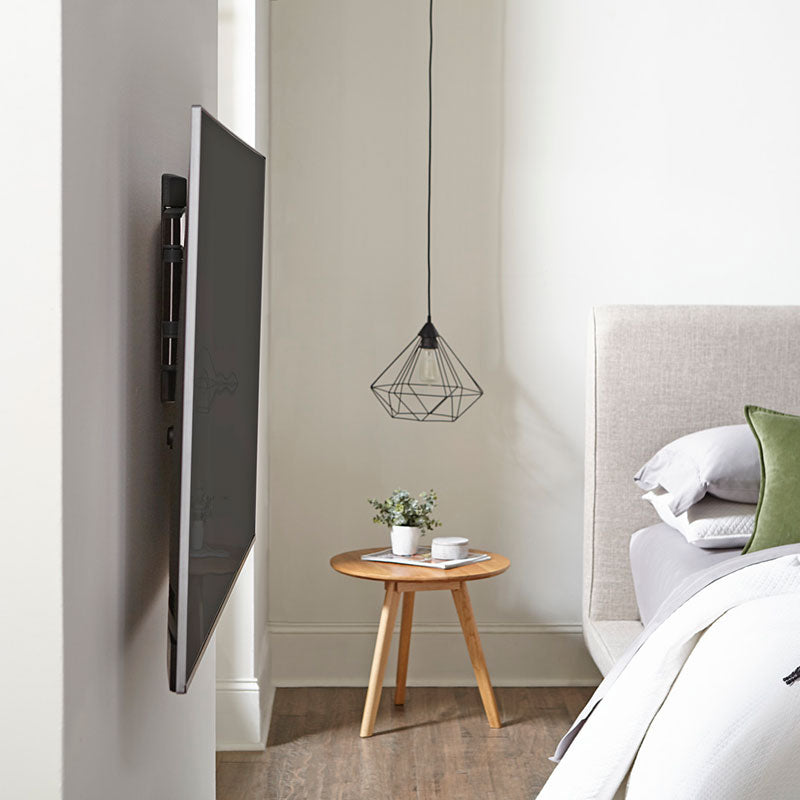 Sanus Medium Premium Full Motion TV Wall Mount VMF720-B2, wall-mounted TV retracted bedroom view