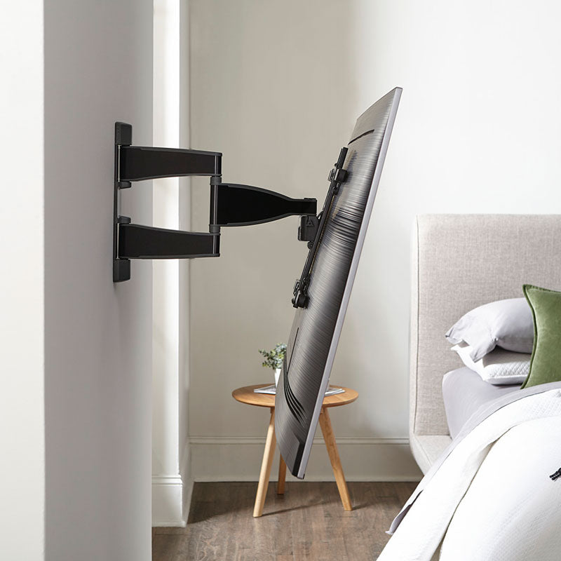 Sanus Medium Premium Full Motion TV Wall Mount VMF720-B2, wall-mounted TV tilted bedroom side view