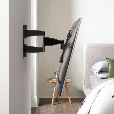 Sanus Medium Premium Full Motion TV Wall Mount VMF720-B2, wall-mounted TV tilted bedroom side view