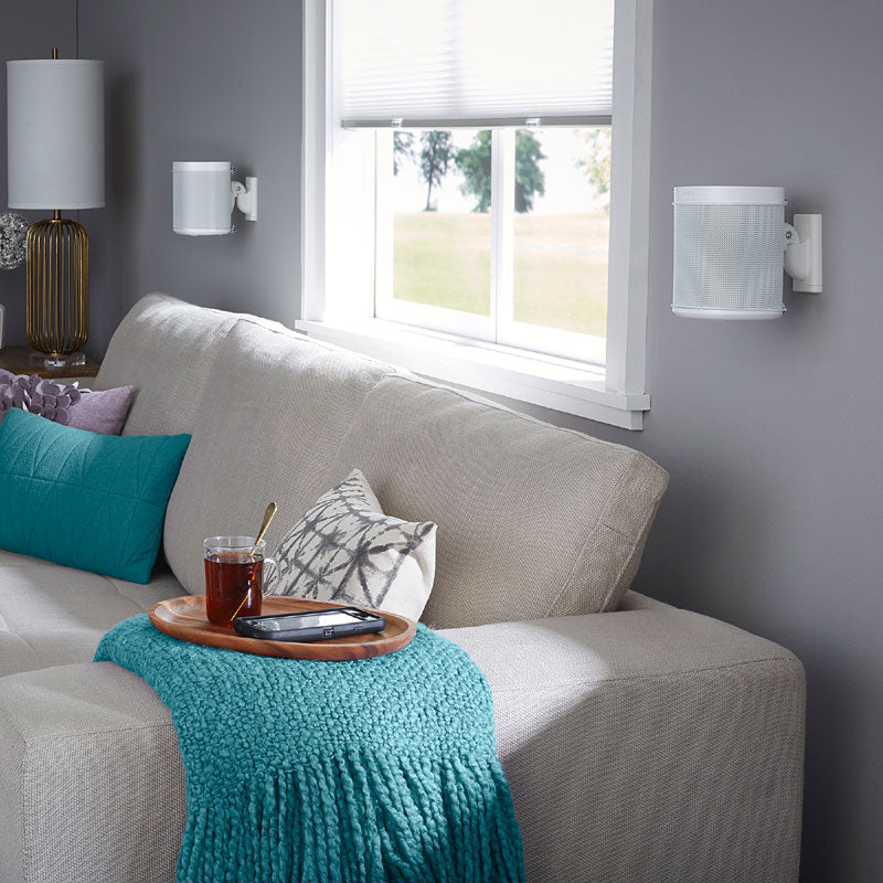 Sanus Wireless Speaker Wall Mount WSWM22-W1, white speakers wall-mounted over sofa