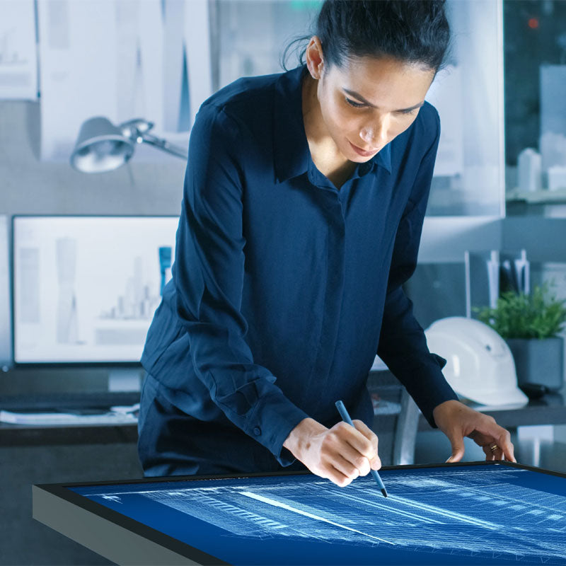 Peerless-AV SmartMount Motorized Height Adjust Tabletop Cart, SR598ML3T, person using touchscreen drafting table