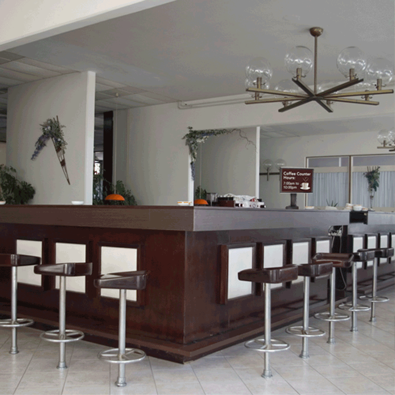 Chief Small Swivel Bolt Down Table Stand STS1, installed hospitality bar view